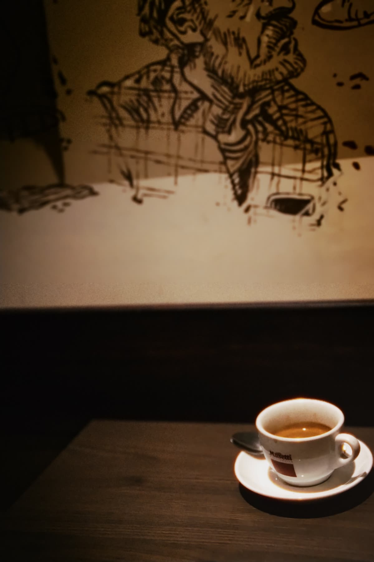 Café table with espresso and mural — the Brume café concept
